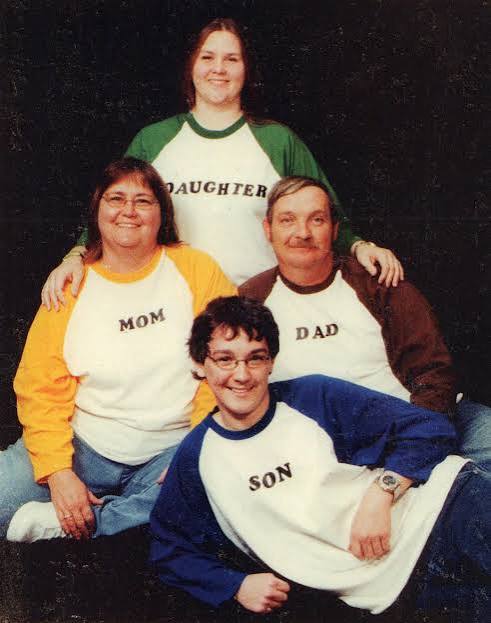 Retro family portrait in matching Mom, Dad, Daughter and Son shirts